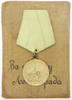 Medal for the Defense of Leningrad with rare early booklet