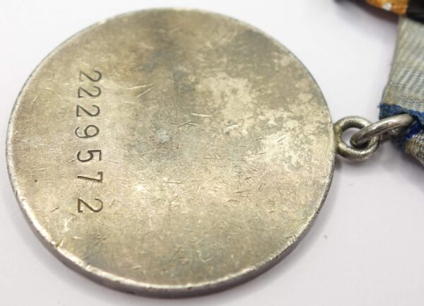 Group of Soviet medals consisting of a Medal for Bravery #2229571 and Medals for Prague, Berlin and Victory over Germany - Image 9