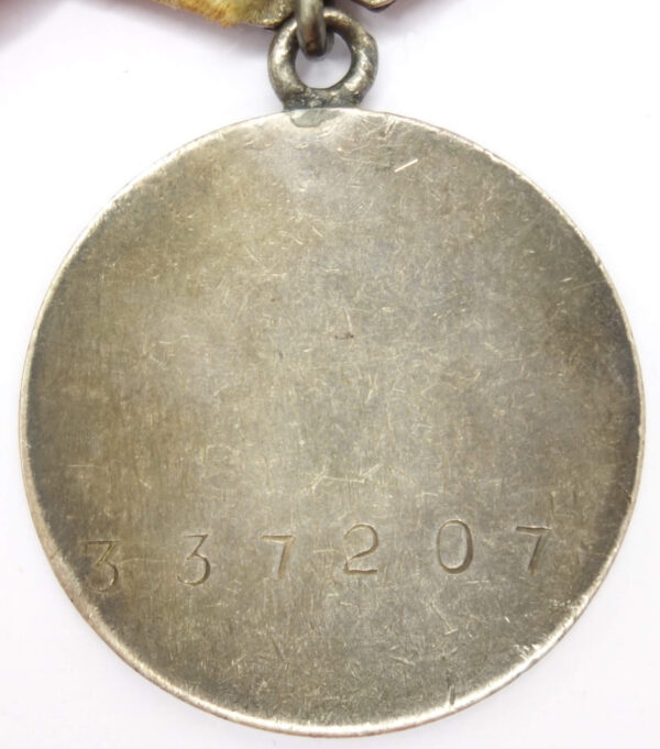 Group of Soviet medals consisting of a Medal for Bravery #1586881, Combat Merit #337207 and campaign medals - Image 9